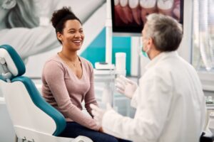 Patient eagerly chatting with dentist in patient’s chair
